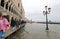 many people on the footbridge with plastic gaiters in Venice in