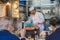 Many people shopping and eating some food at the Tsukiji market