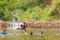 Many people swimming at the small weir irrigate