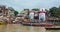 Many people taking water on the Ganges Holy river in Varanasi, India