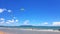 Many people or tourist playing kite surfing on sea with clear blue sky and cloud background and copy space at tropical beach