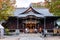 Many people walking around Yohashira Shrine in the cloudy day