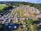 Many pitches for caravans, campers and tents in campsite, aerial view