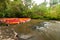 Many plastic canoe dock in river
