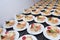 Many plates of appetizers being prepared in commercial kitchen, for an event, selective focus