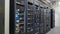 Many powerful servers running in the data center server room. Many servers in a data center. Many racks with servers