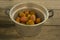 Many prickly pears in a large aluminum pot