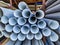 Many PVC Pipes Stacked at Building Supply Shop