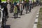 Many racing bikes. A group of cyclists riding during the street