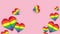 Many rainbow hearts on pink background. Flying hearts lgbt pride symbol