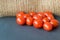 Many red  little tomatoes on the natural background