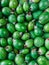 Many ripe feijoa fruits top right view - background