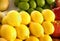 Many ripe lemons on market counter. Fresh citrus fruit