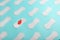 Many Sanitary pads on a blue background in the form of a diagonal pattern with a flower. Textured background all over the screen