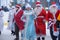 Many Santa Clauses and Snow Maidens dance together, a flash mob