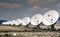 Many satellite dishes all in a row