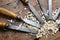 many sharp steel blades many chisels and sawdust chippings in Workbench