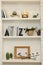 Many shelves with different decor in room. Interior design