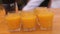 Many shot glasses with alcohol and citrus fruits juice