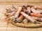 Many shrimp on a wooden plate