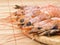 Many shrimp on a wooden plate