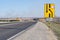 Many signs about road repairs on a country highway