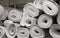 Many silver large rolls of foil insulation