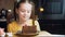 Many slices of cake on a retro-style baking sheet. The chef brings different kinds of cake to the girl's tasting