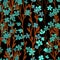 Many small blue turquoise flowers, brown stalks on black background