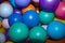 Many Small Colorful Plastic Balls in the Pool Children`s Playroom, Pink, Yellow, Blue, White