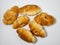 Many small croissants on a white background. Croissants with boiled condensed milk. Confectionery in the kitchen