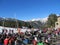 Many snowboarders and skiers relax and sunbathe under the bright rays of the sun at the ski resort. Andorra, Andorra La Vella-