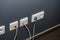 Many sockets in the office wall, close-up