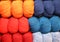 Many soft balls of colored wool to create handmade sweaters