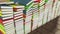 Many stacked colored books