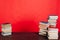 Many stacks of educational books for learning the preparation for exams on a red background