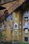 Many stone coats of arms on the wall, located under the staircase, overlooking the park, of the Villa Stibbert in Florence.