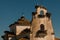 Many storks nests on a church