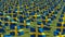 Many Sweden Flags blowing in the wind in green field