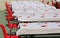 Many tables set outdoors for a community lunch