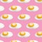 Many tasty fried chicken eggs on pink background