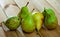 Many tasty pears on wooden surface