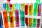 Many test tubes with colorful liquids, closeup