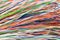 Many thin electrical wires of different colors. Cables for telephone and internet connection. Abstract technology background