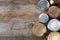 Many tin cans on wooden background, top view