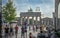 Many tourists and Berliners are on the Pariser Platz next to the Brandenburg Gate