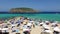 Many tourists at Cala Conta beach in Ibiza, 4k video
