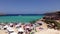 Many tourists at Cala Conta beach in Ibiza