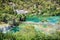 Many tourists are swimming in the river near the waterfalls, Krka, Croatia, national park