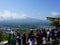 Many tourists on top of mountain Tenjo Yama admire and photograph Mount Fujiyama